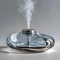Angled overhead view of the diffuser's flowing curves with the headline Sculpted by Water.