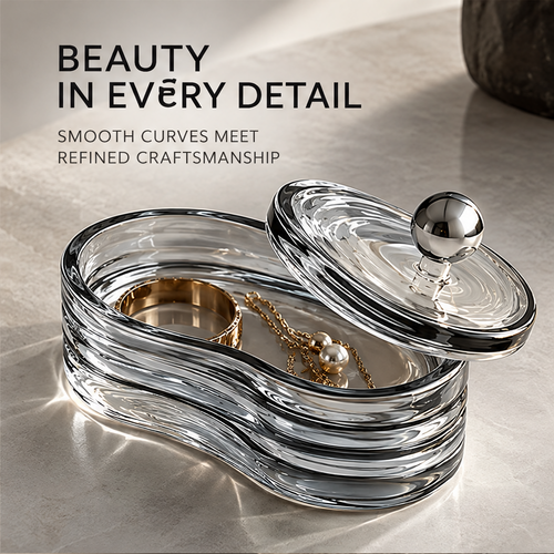 Open curved jewelry box holding a bracelet and necklace, with the lid set at an angle.